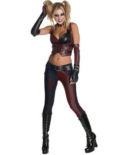 a woman dressed in a costume with gloves and boots is posing for the camera on a white background