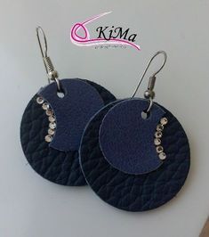 pair of black leather earrings with silver beadings on the bottom and back side