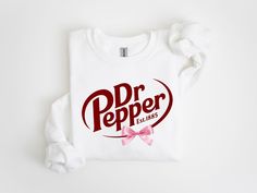 Dr. Pepper Logo Sweatshirt, Dr. Pepper Crewneck, Cute Dr.Pepper Shirt, Dr.Pepper Gifts, Gift for Her, Soda, Bday Gift, Xmas Gift, Coquette,  -------------------------------------------------------------------------------------------------------------------------------- Knit collar Unisex Adult Sizing *How to Place an Order* 1. View all color and size charts before you place your order. 2. Select your shirt "SIZE" and "COLOR". 3. Select the quantity. 4. Click add to cart.  If you are ordering more than 1 item, you need to repeat this process for each item you wish to order. Washing Instructions: Wash inside out, in cold water, on a gentle cycle. Tumble dry low or let air dry. Do not bleach Do not dry clean. Avoid ironing on the design. Size: Take a look at the photos to see a specific sizin Dr Pepper Sweatshirt, Dr Pepper Logo, Dr Pepper Shirt, Bday Gift, Dr Pepper, Logo Sweatshirt, Christmas Wishlist, Sweatshirt Designs, Knit Collar