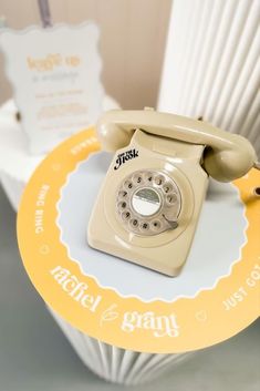 an old - fashioned phone is sitting on a table