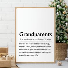 a poster with the words grandparents on it next to presents and a small christmas tree