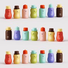 many different colored bottles with faces drawn on them