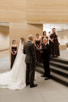 a bride and groom are getting married at the alter