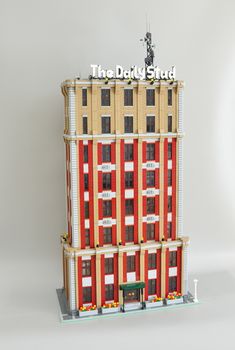 a building made out of legos with the words the daddy stud on it's side