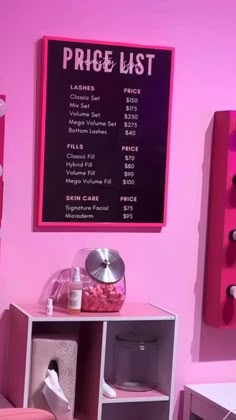 a pink room with lots of items on the shelves and a price list hanging above it