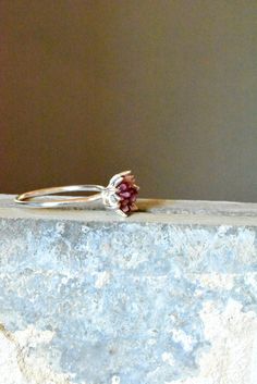 Rough Ruby ring in sterling silver. My best selling lotus flower design is finally available in raw Ruby! A handcrafted .925 sterling silver or 14k white gold band and bright silver cup filled with raw Ruby chips in a mosaic pattern, my signature design. Organic, natural ruby reds in varying shades look pretty and unique next to the bright silver. Ruby is July's birthstone. Made to order, custom ring. I love this ring as sparkly, any occasion present for her, Women's May birthstone gift for her, Sterling Silver Flower Ring With Birthstone For Wedding, Sterling Silver Birthstone Flower Ring For Wedding, Sterling Silver Flower Ring With Accent Stones For Wedding, Valentines Theme, Lotus Flower Jewelry, Raw Ruby, Lotus Flower Design, Present For Her, Valentine Theme