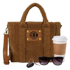 This monogrammed sherpa crossbody tote will be perfect for all of your adventures, and it is perfectly roomy for all of your on-the-go necessities! This bag has a trendy adjustable over-the-shoulder strap along with a 4.5-inch drop handle making it the perfect tote for your everyday events! Customize your bag even more with our Monogrammed Crossbody Straps.Made of polyester sherpa with polyester liningMeasures 14" W x 9.5" H x 4.5" D﻿Features an adjustable cross-body strap and an interior Marley Lilly, Zipper Top, Crossbody Tote, Tote Purse, Crossbody Strap, You Bag, A 4, Burlap Bag, Cross Body