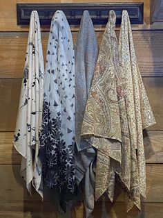 These elegant scarfs come in prints from black and white chiffon, brown paisley, teal paisley, petite orange flowers, and cream with black markings. Fall Paisley Print Shawl, Bohemian Pashmina Scarf With Paisley Print, Vintage Paisley Print Shawl, Black Bohemian Silk Scarf, One Size, Black And White Scarf, Brown Paisley, Boho Shawl, Elegant Scarves, Paisley Scarves