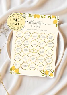 the bridal shower game is sitting on a plate with flowers and leaves around it