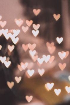 blurry image of many small hearts in the shape of heart shapes on a table