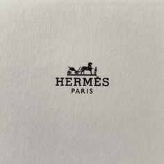 the logo for hermes paris is shown in black and white, with a horse drawn carriage