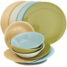 a stack of different colored plates and bowls on a white background with no one in the photo