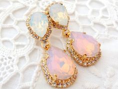 "Pink and white opal Chandelier earrings, Bridal earrings, Bridesmaids gift, Dangle earrings, Drop earrings, Weddings jewelry, Swarovski earrings, Powdered pink, Blush pink, Beauty with Statement. These stunning earrings have a great statement look that can't be missed. They would be great bridal earrings or with an evening dress. Wonderful bridesmaids' gift They are made of 14k gold plated brass posts, Swarovski crystals, all set in prong setting. Made with CRYSTALLIZED™ - high qulity genuine S Opal Drop Earrings For Wedding, Silver Opal Earrings For Wedding, Opal Jewelry With Matching Earrings For Wedding, Bridesmaid Earring, Blue Bridal Earrings, White Opal Earrings, Earrings Chandelier, Earring Dangle, Earrings Bridesmaid