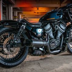 a black motorcycle parked in a parking garage