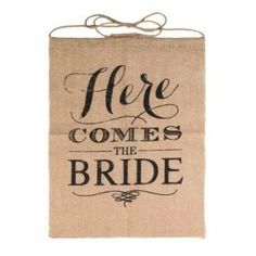 a burlock sign that says here comes the bride