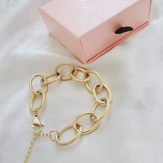 This link bracelet is a versatile chunky classy piece that goes with any look. Wear it with another bracelets to create an arm party. You can also linked this bracelet with another bracelet to wear them as a choker or link this bracelet with a choker for a longer length. Bracelet Details: Material: 18K Gold Plated & Stainless Steel Length: 7' Inch and you can add 2 inches with the extender Thickness: 12mm Quantity: 1 Color: Gold Does not tarnish/change color overtime Water Resistant Check Our Je Trendy Metal Jewelry With Rectangular Links, Trendy Metal Link Charm Bracelet, Chic Adjustable Paperclip Link Bracelet, Modern Jewelry Chunky Chain Choker, Modern Chunky Chain Link Bracelets, Modern Chunky Chain Choker Jewelry, Trendy Oval Link Metal Bracelets, Modern Chunky Link Bracelets, Trendy Metal Link Bracelets