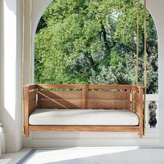 a porch swing hanging from the ceiling