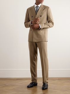 ZEGNA's suit is impeccably tailored from Trofeo™ wool-twill, an Australian fabric prized for its softness and breathability. Fully lined for structure, the jacket is cut in an elegant double-breasted profile with sharp peak lapels and contrasting button closures. The trousers have unfinished hems, so you can adjust the break. Timeless Double Breasted Suit For Work, Timeless Tailored Double-breasted Suits, Luxury Double-breasted Three-piece Suit For Work, Timeless Double Breasted Suit In Suiting Fabric For Work, Luxury Notch Lapel Three-piece Suit For Work, Professional Wool Three-piece Suit For Work, Luxury Double Breasted Suit With Suit Collar, Luxury Double-breasted Suit With Suit Collar, Tailored Luxury Three-piece Suit For Work