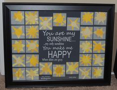 a black frame with yellow and gray stars on it that says you are my sunshine