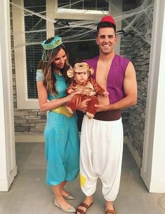 a man and woman dressed up as disney characters