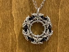 Chainmail Infinity Necklace. Aluminum and Anodized Aluminum ring are woven together to form this beautiful piece. Chain is 24 inches long with a 3-inch extender chain made from stainless steel.