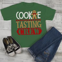 "Kids Christmas T Shirt Cookie Tasting Crew Matching Xmas Shirts Cute Graphic Tee Toddler Boy's Girl's This graphic tee is perfect for Christmas! Let everyone know you're with the cookie tasting crew. Grab the matching cookie baking crew from our shop and you'll have a whole team of bakers and tasters! This adorable design is available on several styles so you can outfit the whole family in matching Christmas shirts. Get in the holiday spirit and start your baking early this year! It would not b Kids Elf Outfit, Kids Christmas T Shirts, Elf T Shirt, Elf Shirt, Matching Christmas Shirts, Shirts Cute, Toddler Valentines, Elf Clothes, Step Sister