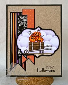 a happy halloween card with pumpkins in a box