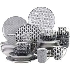 a black and white dinner set with cups