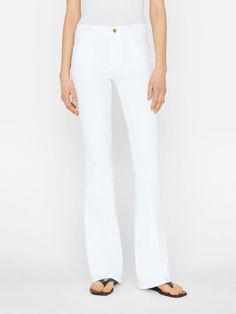 Le High Flare Pants in Blanc White from FRAME. This high-rise flare jean puts a decidedly fresh spin on the 70s silhouette. Cut from ultra-soft, super-stretch denim, this pair is form fitting through the hips and thighs, kicking out into an easy flare from the knees.Please note: we are in the process of updating our denim hardware. Items will ship with either gold or silver hardware. WE RECOMMEND YOU ORDER YOUR USUAL SIZE 70s Silhouette, Jeans White, The 70s, Silhouette Cut, Flared Jeans, Mozambique, Flare Pants, Flare Jeans, Stretch Denim