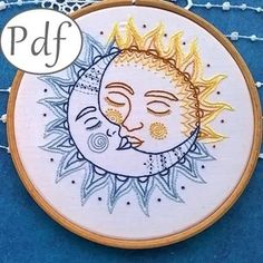 a sun and moon embroidery pattern on a blue background with the words pdf above it