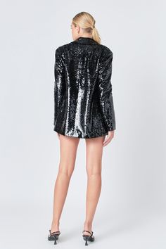 This Sequin Oversized Jacket is a chic addition to your wardrobe. Featuring a taffeta peaked lapel and V neckline this jacket is sparkly and eye-catching with its sequin embellishments. The long sleeves make it a perfect option for a night out or special occasion. This statement piece is sure to make you stand out. Enhance your style and make a statement with this Sequin Oversized Jacket! Sequins Taffeta peaked lapel V neckline Long sleeves Shoulder pads Contrast fake flap pocket Front button cl Chic Embellished Outerwear For Party Season, Chic Sequined Evening Outerwear, Chic Sequined Outerwear For Evening, Embellished Outerwear For Party Season And Night Out, Glamorous Embellished Outerwear For Party, Glamorous Embellished Party Outerwear, Glamorous Long Sleeve Blazer For Work, Glamorous Sequined Blazer For Party Season, Glamorous Long Sleeve Embellished Blazer