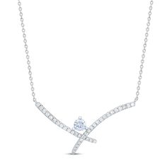 Featuring an astounding round First Light® diamond set in 14K white gold, this remarkable women's necklace brings fiery color to brilliance. The diamond suspends above two intersecting curves draped in even more brilliant round diamonds. The pendant suspends from a rolo chain that adjusts to up to 19 inches and secures with a trigger clasp. The total diamond weight of the necklace is 5/8 carat. Certified by Gia, the First Light® diamond from Leo Schachter features Fire Prism™ technology which re Anniversary Necklace With Tension Setting In Cubic Zirconia, Diamond White Necklace With Tension Setting For Anniversary, Fine Jewelry Necklace With Tension Setting For Anniversary, Fine Jewelry Necklaces With Tension Setting For Anniversary, White Gold Necklace With Tension Setting For Anniversary, White Gold Necklaces With Tension Setting For Anniversary, Diamond Necklace With Tension Setting And Round Cut, White Gold Diamond Necklace With Tension Setting, Fine Jewelry Diamond Necklace With Tension Setting