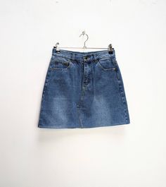 "a vintage blue denim mini-skirt ✿ IMPORTANT INFORMATION: * excellent vintage condition * material: 100% cotton * size: small - please check exact measurements below (they're there for your benefit!) * garment care: machine washable ✿ MEASUREMENTS (taken while item is lying flat, some measurements will need to be doubled): * waist: 13.5\" (34cm) * hips: 18\" (46cm) * length: 16.5\" (42cm) ✿ free UK shipping on orders over £100 with code STRAWBERRY free international shipping on orders over £250 Cheap 90s Mini Denim Skirt, Denim Blue Mini Denim Skirt, Denim Blue Mini Skort, Vintage Denim Skirt In Denim Blue, Retro Denim Mini Skirt, Retro Blue Denim Mini Skirt, Vintage Blue Mini Denim Skirt, Retro High Waist Medium Wash Denim Skirt, Vintage Denim Mini Bottoms