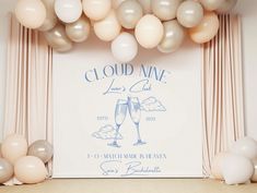 an image of a party with balloons on the wall and champagne glasses at the front