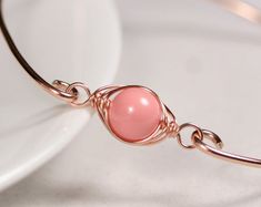 White Pearl Bangle Bracelet Wire Wrapped Jewelry Handmade Handmade Rose Gold Pearl Bracelet, Elegant Pink Wire Wrapped Bracelets, Wire Wrapped Rose Gold Bracelet, Rose Gold Wire Wrapped Bracelet, Rose Gold Bangle Bracelets For Jewelry Making, Rose Gold Bangle Pearl Bracelet As A Gift, Pink Gold Metal Bracelet, Elegant Pink Gold Metal Bracelets, Elegant Pink Gold Metal Bracelet