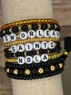 The ultimate bracelet listing for any New Orleans Saints Football fan! Go Saints! These bracelets are SOLD INDIVIDUALLY unless purchased as a STACK! If wanting multiple bracelets, please add each one individually to your cart! Bracelets with letter beads can be personalized to exchange for a different word/name or player number. Please use the personalization box if wanting this; otherwise, your bracelet will come as pictured! (If you choose personalization for bracelets other than those with le Saints Game Day Outfit, New Orleans Saints Shirts, Football Outfit, Football Bracelet, Saints Shirts, New Orleans Saints Football, Saint Jewelry, Multiple Bracelets, Saints Football