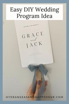 a person holding up a book with the title easy diy wedding program idea