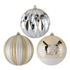 three christmas ornaments with gold and silver decorations on top of each ornament, one in the shape of a ball