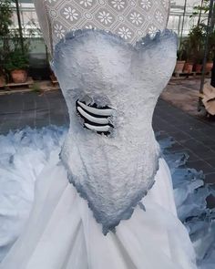 a white wedding dress with black and white accents