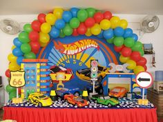 a birthday party with cars and balloons