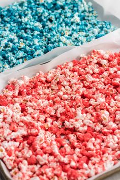 two trays filled with red, white and blue popcorn