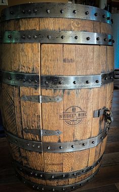 a large wooden barrel with metal straps on it