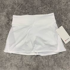 Nwt Lululemon Play Off The Pleats Skirt Womens Size 2 Color Is White Length Is 13" (Reg Length) Built In Shorts In Perfect Condition Reasonable Offers Are Welcome! White Athleisure Short Skirt, White Short Athleisure Skirt, White Lined Skort For Athleisure, White Tennis Shorts With Lined Skirt, White Lined Skirt Shorts For Tennis, White Tennis Shorts With Skirt Lining, White Lined Tennis Skirt For Workout, White Lined Athleisure Skirt, White Lined Sports Skirt