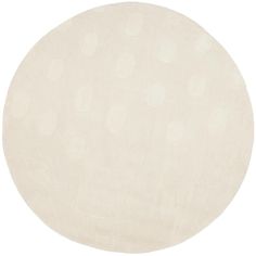 a round rug with white circles on it