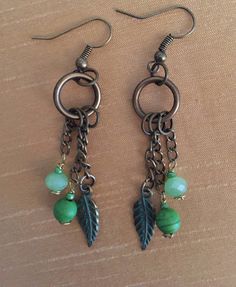 These boho-style earrings are perfect for work or in any casual setting. They are long, with lots of movement, and feature crystal and reconstituted turquoise beads with a bronze-colored feather charm. They can be made in other colors -- just ask. Order another item from my shop at the same time and both will ship for one charge to U.S. addresses. Order a third item and shipping for all 3 is free. Beautiful Beaded Jewelry, Diy Jewelry Earrings, Bijoux Fil Aluminium, Boho Style Earrings, Jewelry Design Earrings, Earrings Inspiration, Homemade Jewelry, Handmade Wire Jewelry, Flower Beads