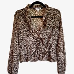 Steve Madden Sheer Long-Sleeve Cheetah Print Ruffle Blouse - Us Size M Condition: Nwot - Never Been Worn Fabric: 100% Polyester Detail: Ruffled Trim, Elastic Cuffs & Waist, Front Snap Button Closure, Flounce Hem, Hand-Wash Shoulder To Waist: 17.5" Sleeve Length: 23" Comes From Smoke-Free Environment. Spring Leopard Print Workwear Blouse, Trendy Long Sleeve Leopard Print Blouse, Spring Leopard Print Ruffled Blouse, Fall Leopard Print Blouse With Ruffles, Fitted Leopard Print Blouse For Work, Chic Fall Tiger Print Tops, Leopard Print Long Sleeve Top For Work, Spring Leopard Print Tops With Ruffles, Cheetah Print