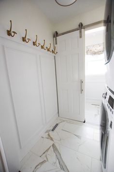 a washer and dryer in a small room