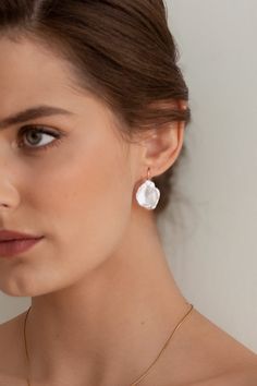 The Iris Pearl Earrings are handcrafted with baroque pearls-each pair is completely unique. They're paired simply with a 14k gold-filled ear wire to accentuate each pearl's natural beauty and charm.  Packaged in an elegant plastic-free reusable jewelry box, this necklace makes the perfect gift or special treat for oneself.   *14k gold-filled ear wires *Freshwater carved pearls (approximately 21-23mm height) *Hypoallergenic, suitable for even the most sensitive skin *Delivered in a 100% silk jewe Delicate Baroque Pearl Earrings With Pearl Charm, Delicate Baroque Pearl Earrings For Pierced Ears, Delicate Baroque Pearl Drop Earrings, Delicate Baroque Pearl Earrings, Delicate Baroque Pearl Teardrop Earrings, Garnet Heart, Money Images, Silk Jewelry, Real Pearls