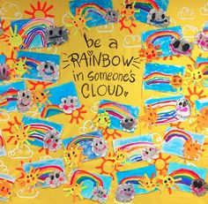 a bulletin board that has been decorated with rainbows, bears and sunflowers