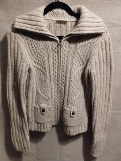 "This is a lovely Vintage Ann Taylor Loft Wool Blend Cable/Ribbed Knit Zip Front Cardigan Sz S. Made in Hong Kong of 64% wool, 22eck% acrylic, 9% nylon and 5% mohair and features a wide ribbed collar that converts into a turtleneck and side pockets. It has been gently worn and is in excellent condition. Measurements Length 22\" Shoulders 17\" Sleeves 25\" Bust 38\"" Winter Wool Cable Knit Cardigan, Cold Weather Cable Knit Merino Wool Cardigan, Cold Weather Merino Wool Cable Knit Cardigan, Cable Knit Merino Wool Cardigan For Cold Weather, Cozy Chunky Knit Fitted Sweater Coat, Knitted Wool Cardigan For Winter, Fitted Cable Knit Sweater Coat, Fitted Cable Knit Cardigan For Cold Weather, Casual Wool Knitted Cardigan